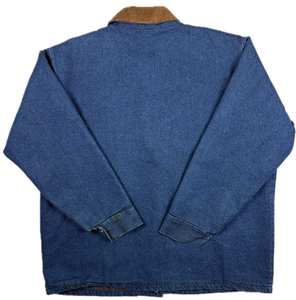 Back view of a vintage Adolphe Lafont blanket lined denim work jacket showing the faded blue denim and straight chore coat shape.
